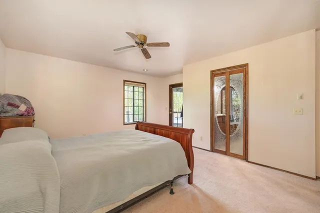 a bathroom with a toilet and a bathtub
