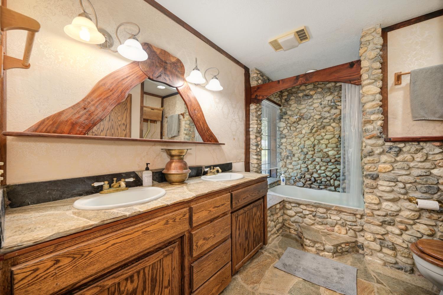 15310 Tyler Foote Road Nevada City, CA 95959 - Photo 27 of 63 a bathroom with a sink a vanity and a mirror