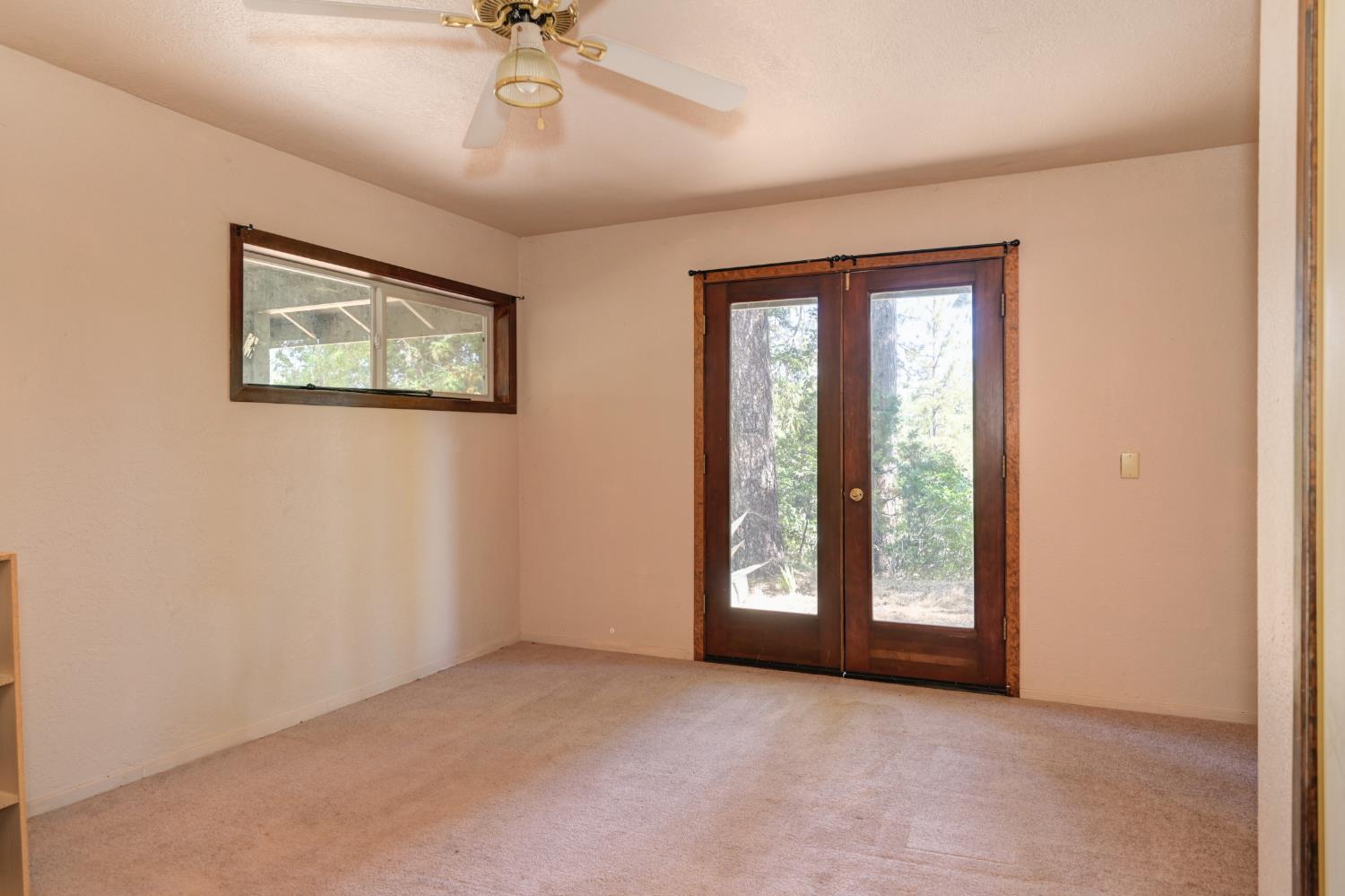 15310 Tyler Foote Road Nevada City, CA 95959 - Photo 29 of 63 an empty room with windows and fan
