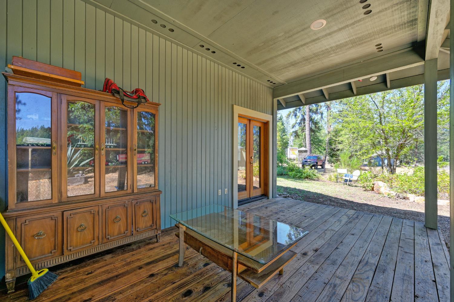 15310 Tyler Foote Road Nevada City, CA 95959 - Photo 32 of 63 a view of a porch with wooden floor and furniture