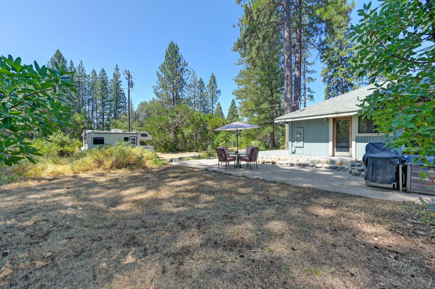 15310 Tyler Foote Road Nevada City, CA 95959 - Photo 43 of 63 a view of a house with backyard and sitting area