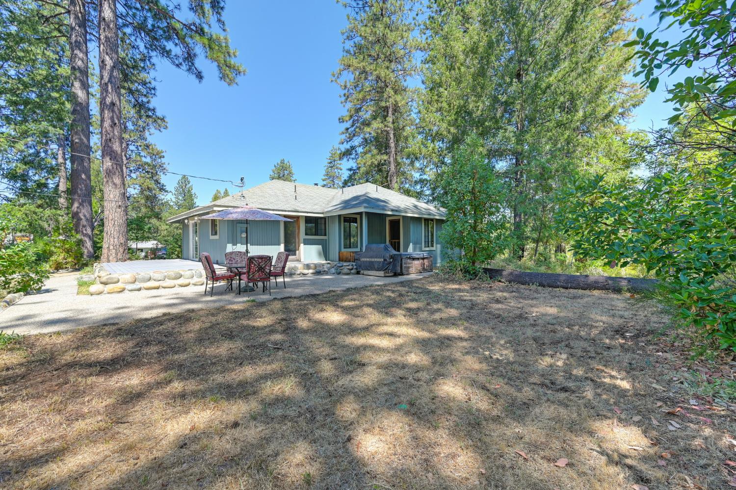 15310 Tyler Foote Road Nevada City, CA 95959 - Photo 44 of 63 a view of a patio with furniture and a small yard