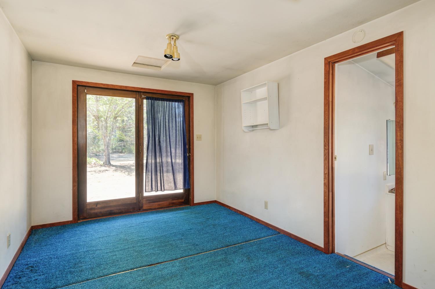 15310 Tyler Foote Road Nevada City, CA 95959 - Photo 50 of 63 an empty room with wooden floor and windows