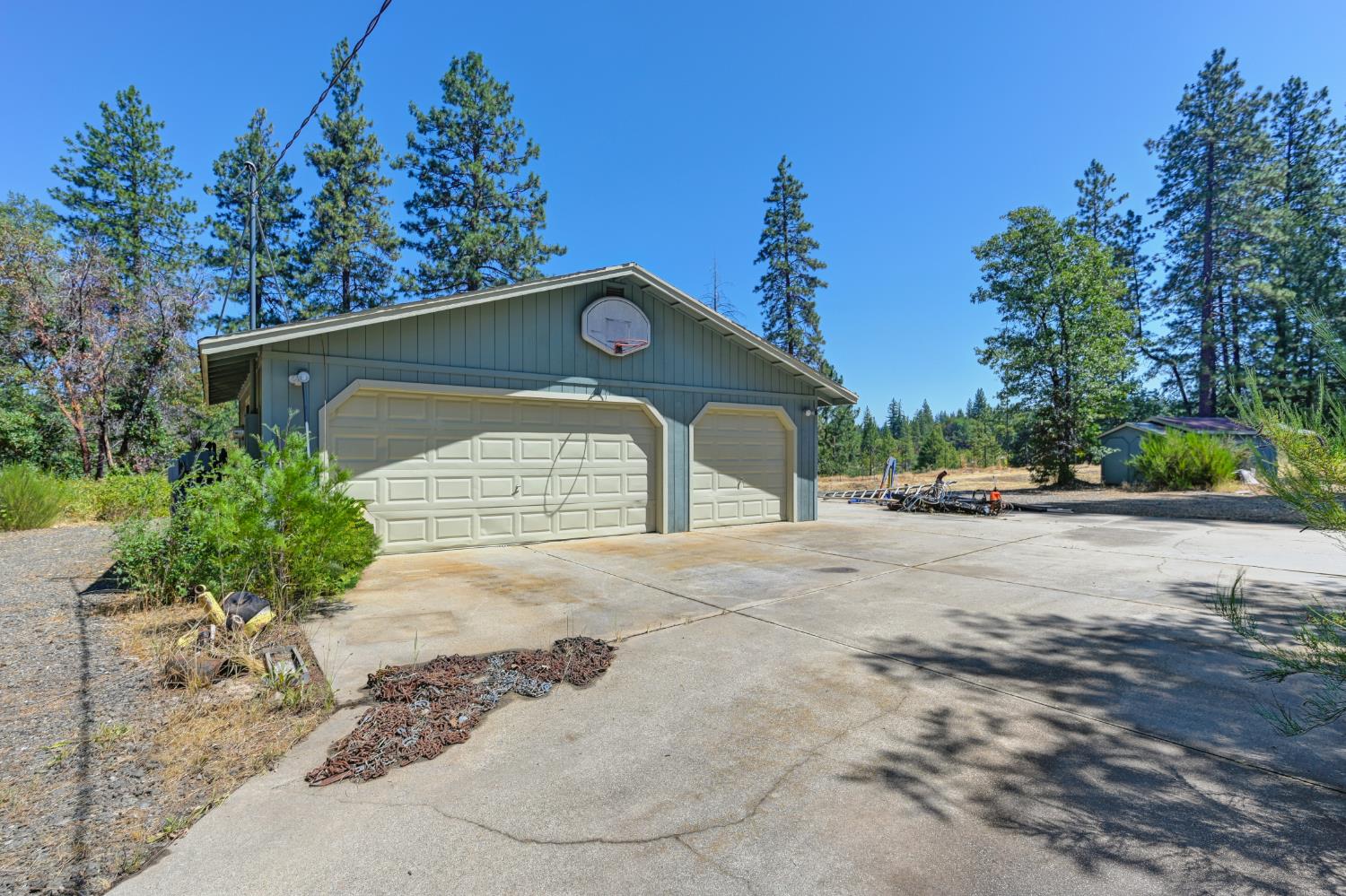 15310 Tyler Foote Road Nevada City, CA 95959 - Photo 55 of 63 a front view of a house with a yard and garage