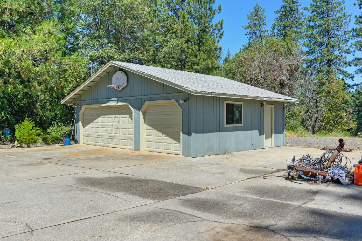 15310 Tyler Foote Road Nevada City, CA 95959 - Photo 56 of 63 a front view of a house with a yard and garage