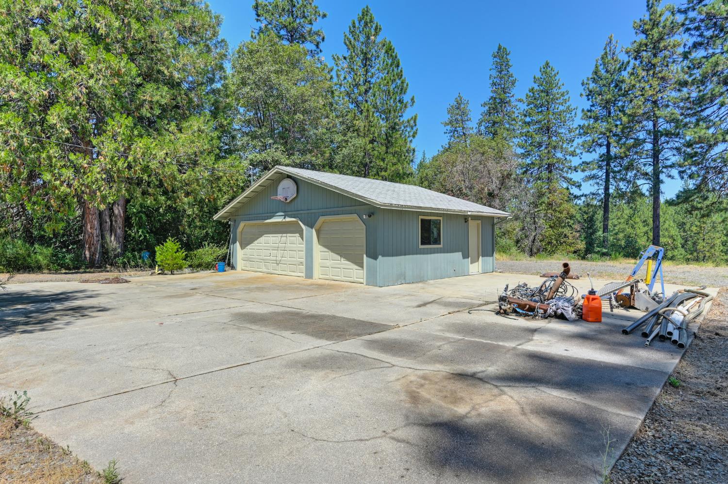 15310 Tyler Foote Road Nevada City, CA 95959 - Photo 57 of 63 a front view of a house with a yard and garage