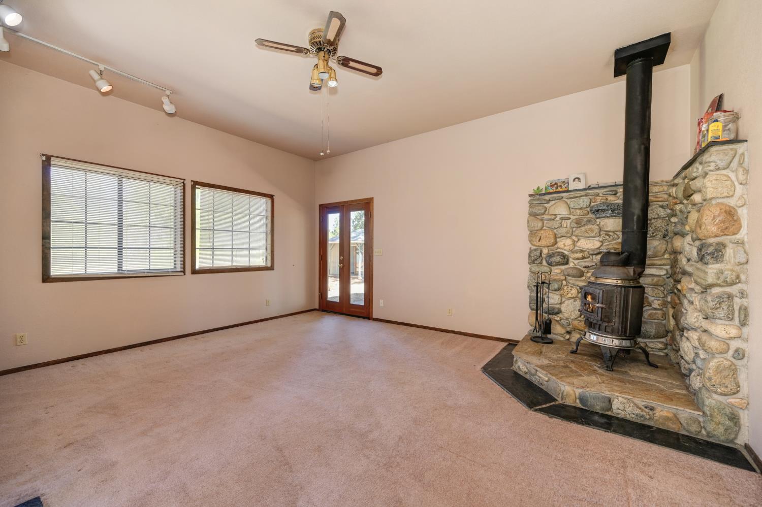 15310 Tyler Foote Road Nevada City, CA 95959 - Photo 9 of 63 a view of empty room with a fireplace