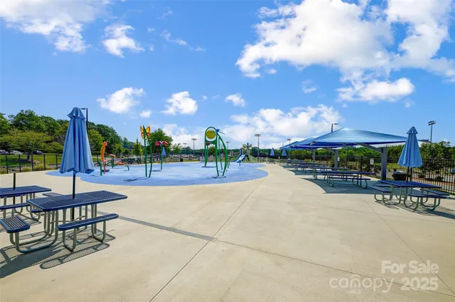a view of a patio with swimming pool