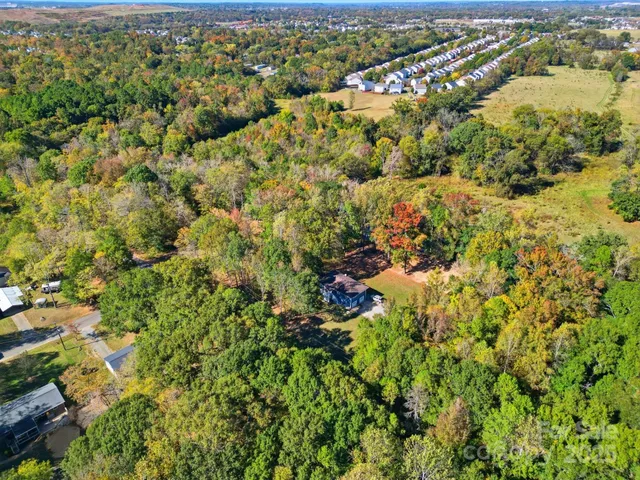 a view of a houses with a lush green field