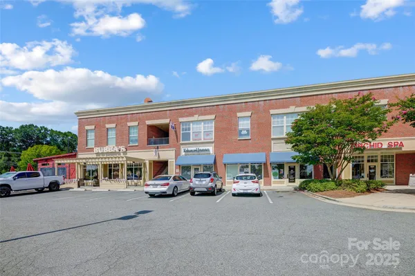 a city street lined with buildings and cars