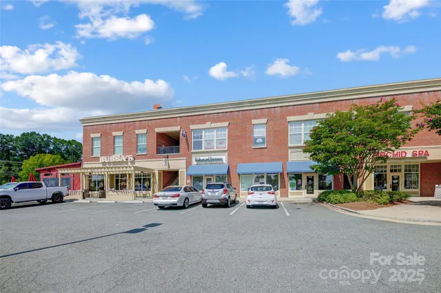 a city street lined with buildings and cars