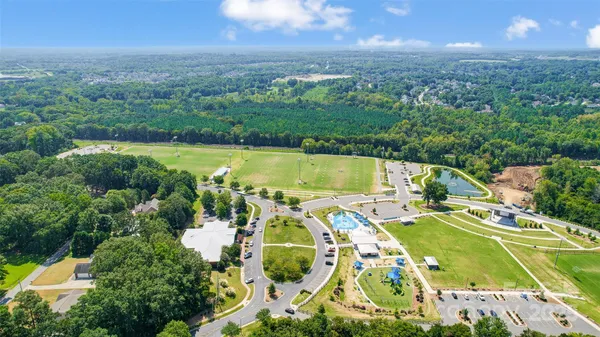 a view of a swimming pool with a yard
