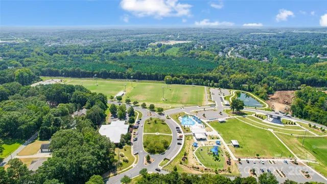 a view of a swimming pool with a yard