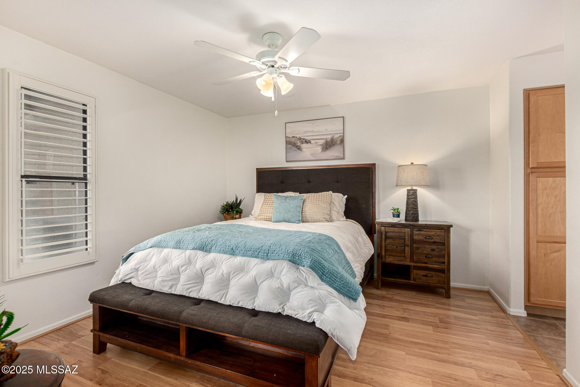 5855 North Kolb Road, Unit 8102 Tucson, AZ 85750 - Photo 6 of 28 a bedroom with a bed and a chandelier