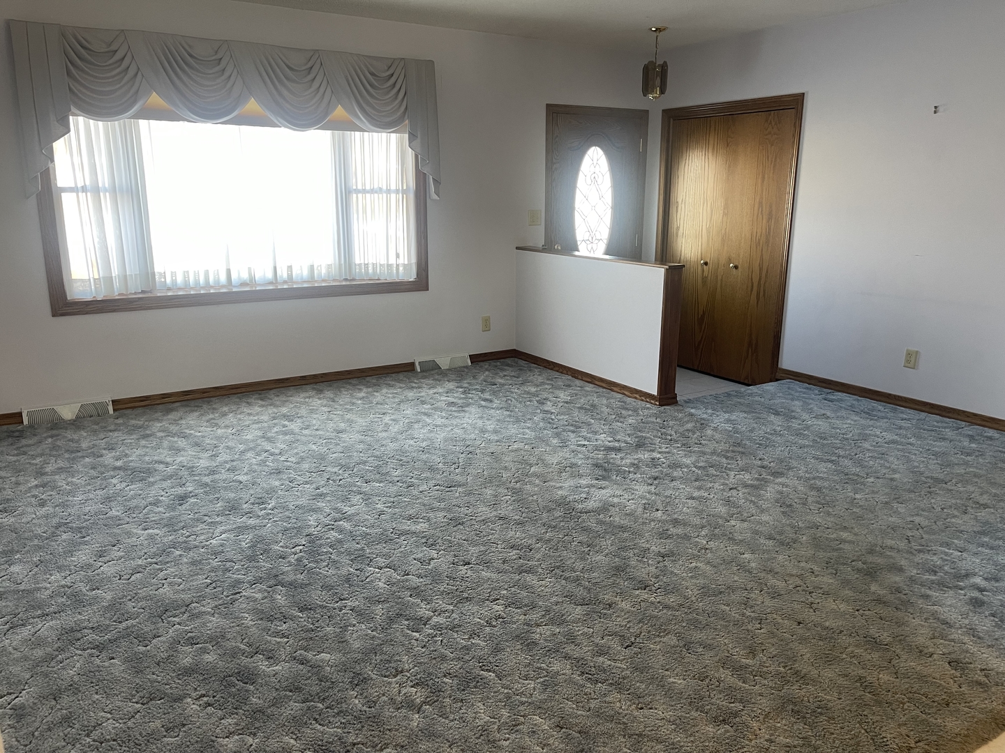 1308 Sunset Drive Peru, IL 61354 - Photo 7 of 19 an empty room with windows and mirror