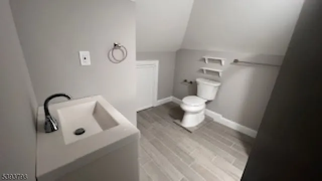 a bathroom with a toilet and a sink