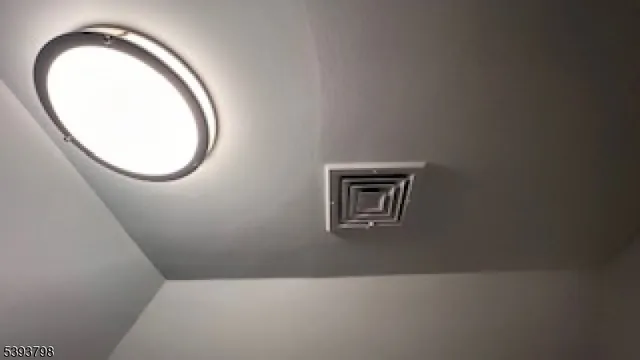 an empty room with a mirror