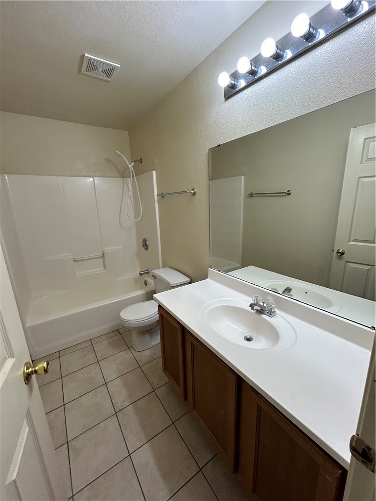 1401 Dewitt Street Corpus Christi, TX 78418 - Photo 8 of 11 a bathroom with a double vanity sink mirror and toilet