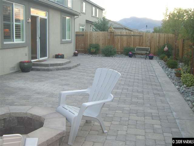 10823 Rushing Flume Drive Reno, NV 89521 - Photo 8 of 9 a view of backyard with table and chairs and wooden fence