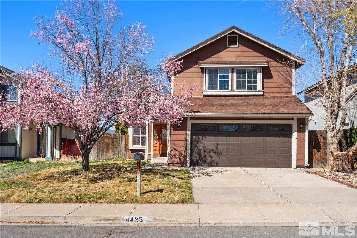 4435 Perro Lane Reno, NV 89502 - Photo 1 of 35 a front view of a house with garage and yard