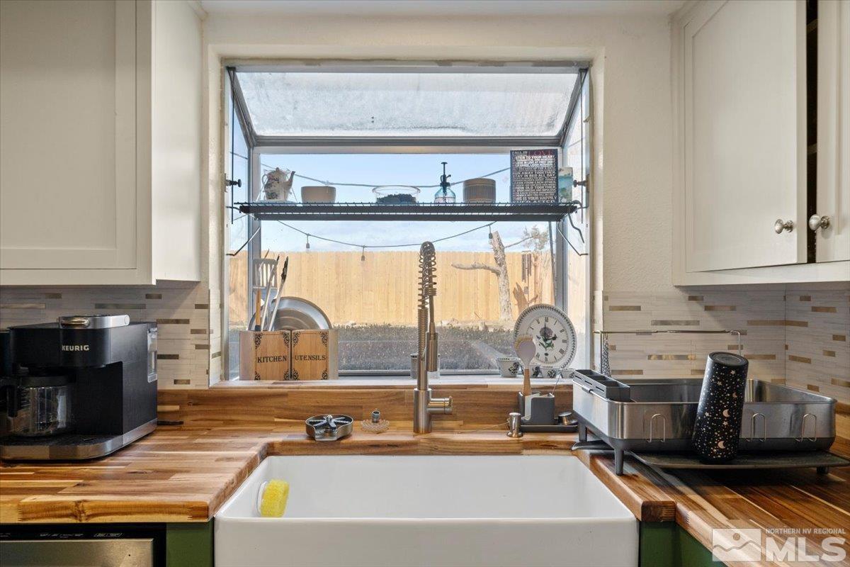 4435 Perro Lane Reno, NV 89502 - Photo 11 of 35 a kitchen with a sink and a stove top oven