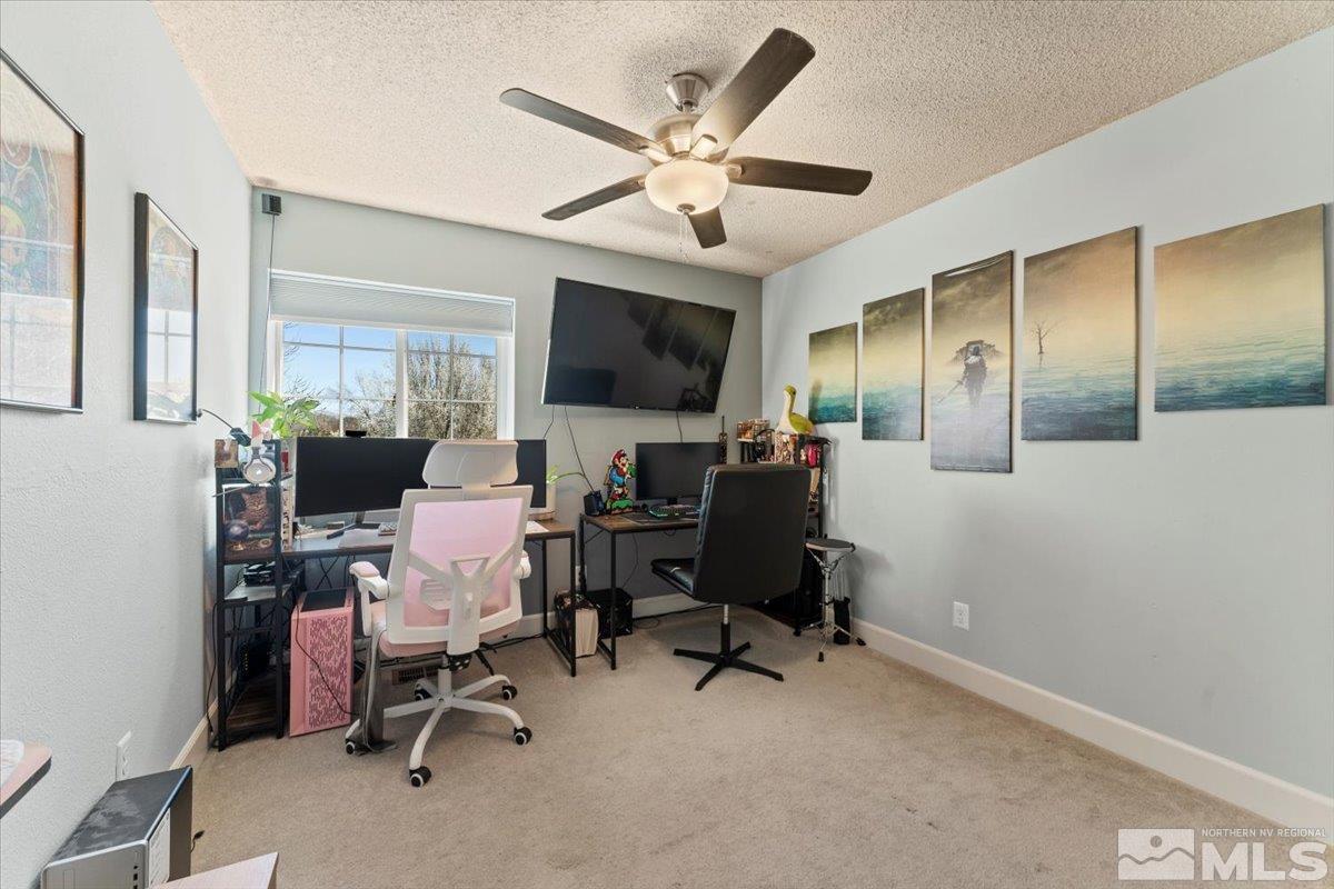 4435 Perro Lane Reno, NV 89502 - Photo 17 of 35 a workspace with wooden floor and a ceiling fan