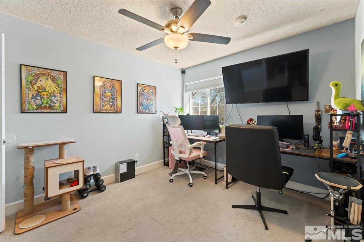 4435 Perro Lane Reno, NV 89502 - Photo 18 of 35 a living room with furniture and a flat screen tv