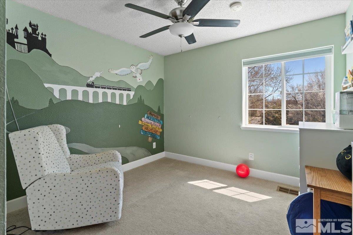4435 Perro Lane Reno, NV 89502 - Photo 20 of 35 a living room with furniture and a window