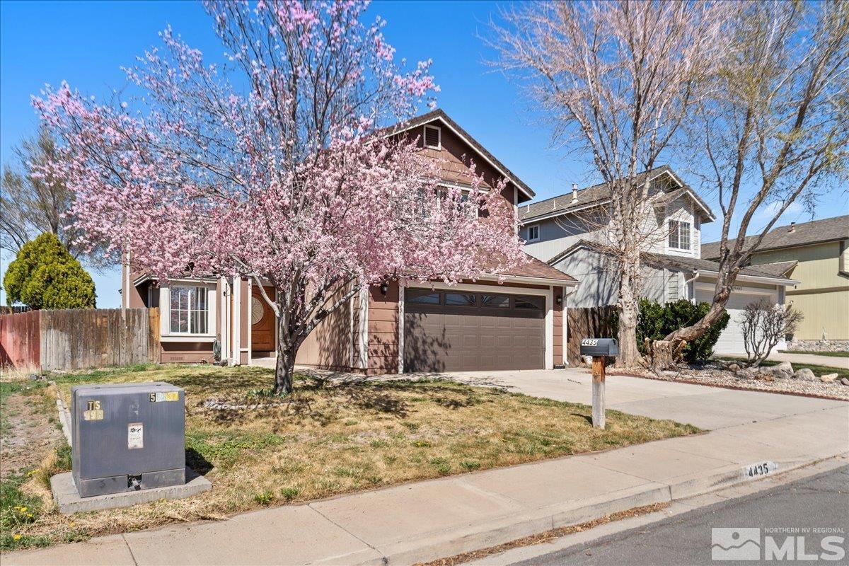 4435 Perro Lane Reno, NV 89502 - Photo 3 of 35 a front view of a house with a yard
