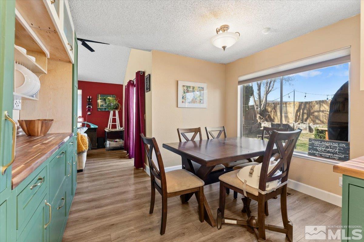 4435 Perro Lane Reno, NV 89502 - Photo 8 of 35 a view of a dining room with furniture and a chandelier
