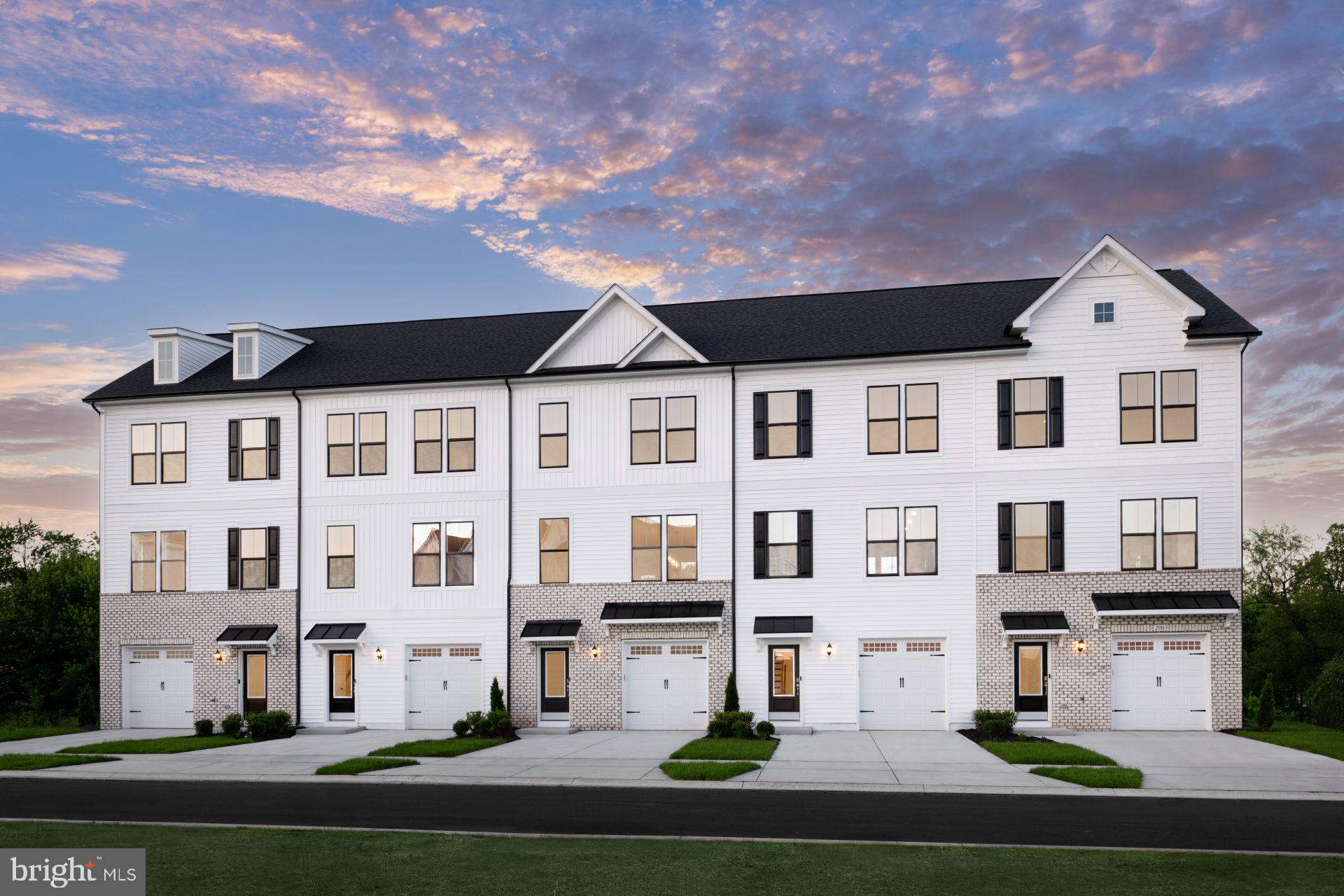 a front view of residential houses with street