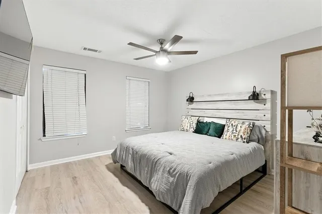 a bedroom with a bed and a window