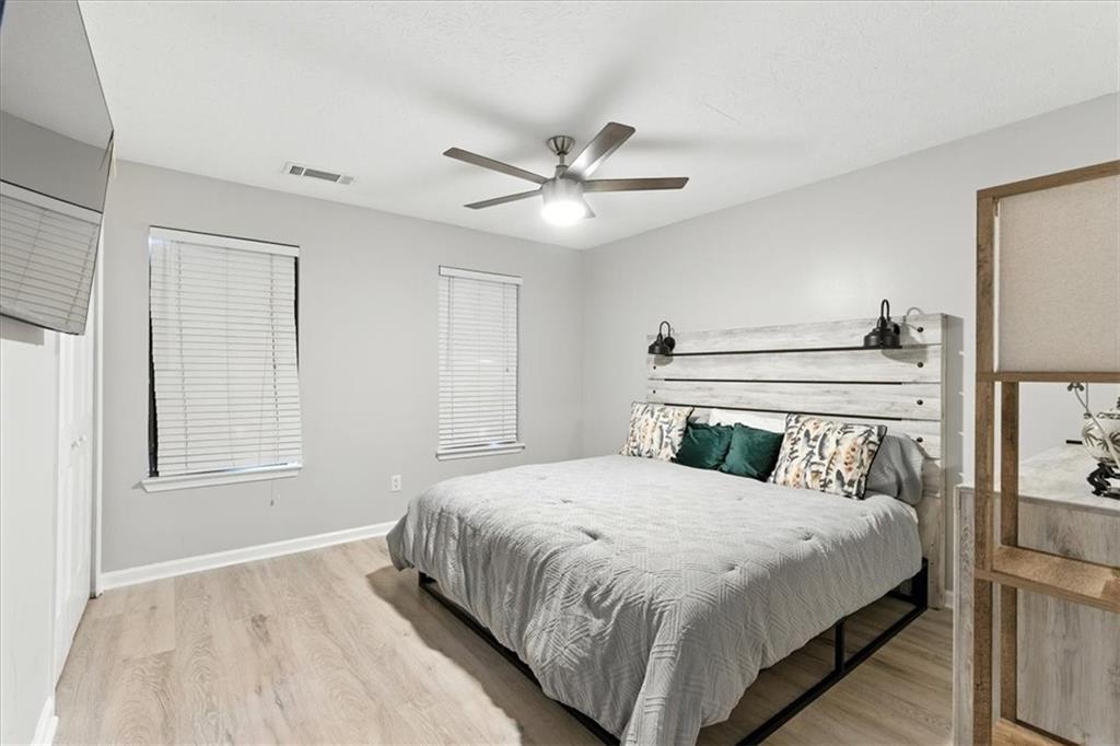 1524 Springleaf Circle Southeast Smyrna, GA 30080 - Photo 9 of 20 a bedroom with a bed and a window