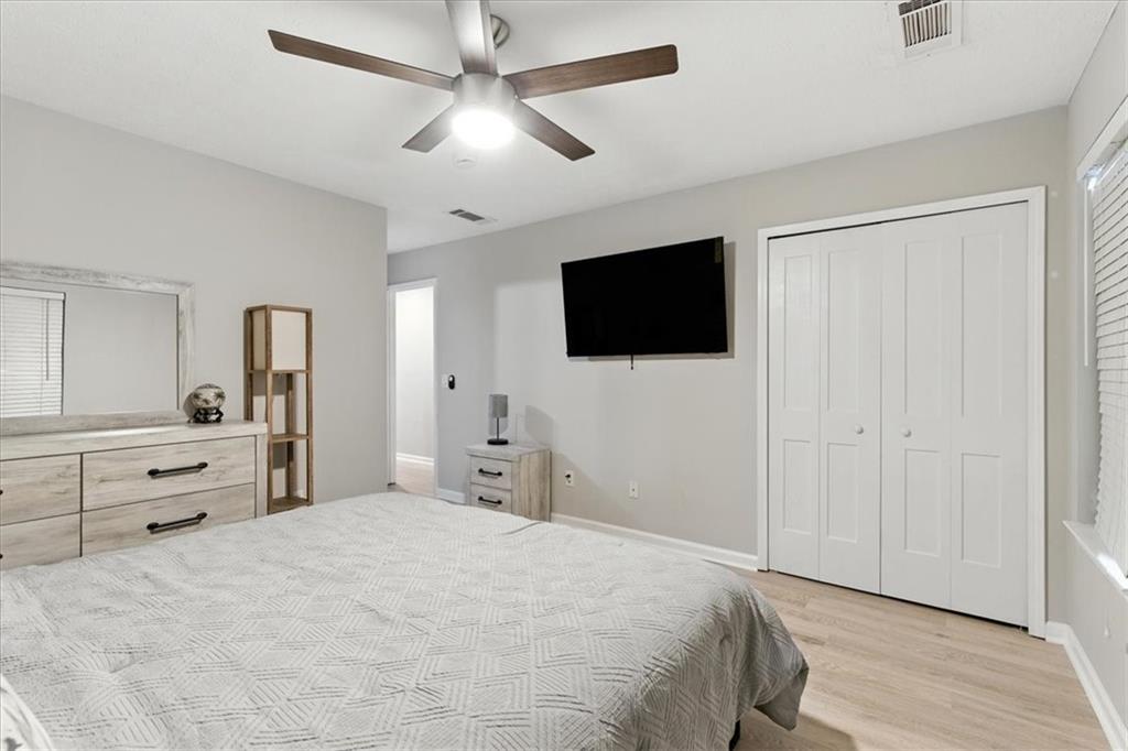 1524 Springleaf Circle Southeast Smyrna, GA 30080 - Photo 10 of 20 a bedroom with a bed and a flat screen tv