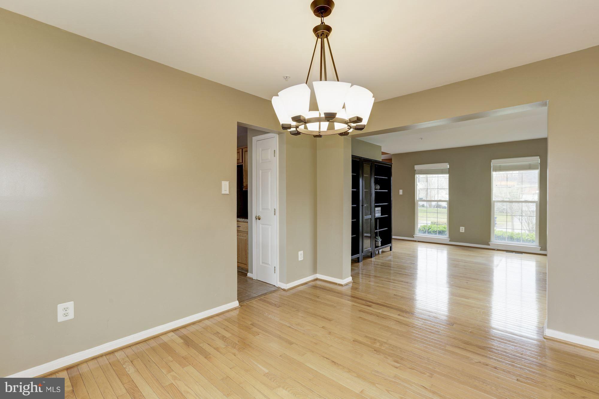 11303 Old Cistern Lane Laurel, MD 20708 - Photo 14 of 38 Open concept living room and dining room