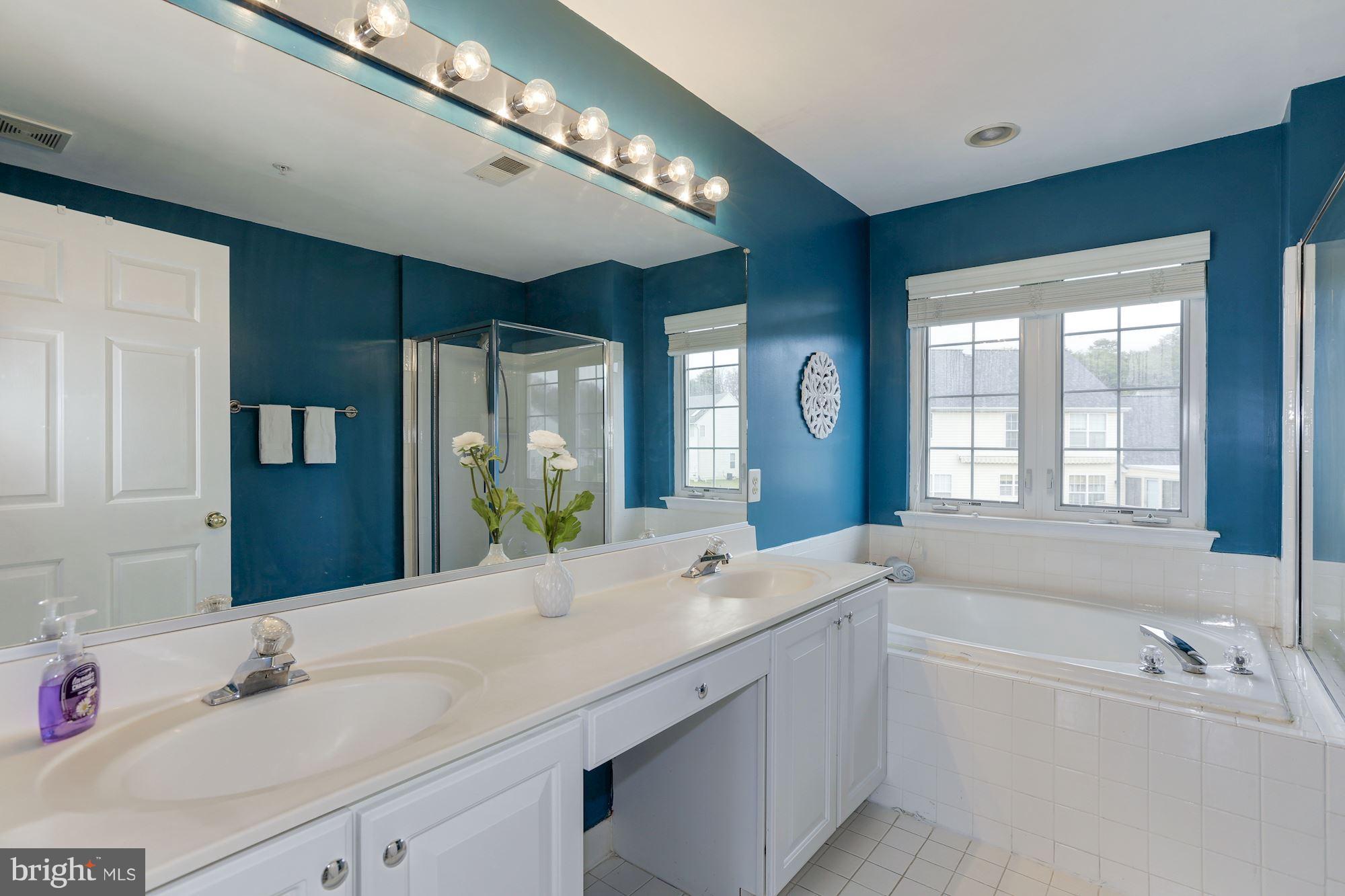 11303 Old Cistern Lane Laurel, MD 20708 - Photo 22 of 38 Master bathroom with modern paint color