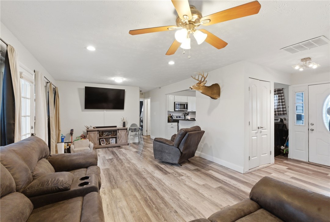 441 Townsend Place Riverside, OH 45431 - Photo 7 of 34 This inviting living space features warm flooring and bright recessed lighting.