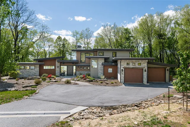 a living room with fireplace furniture and a fireplace