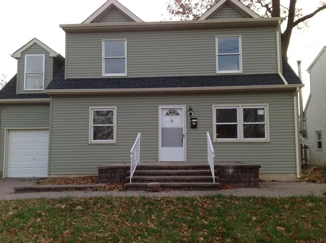 a view of a house with small yard