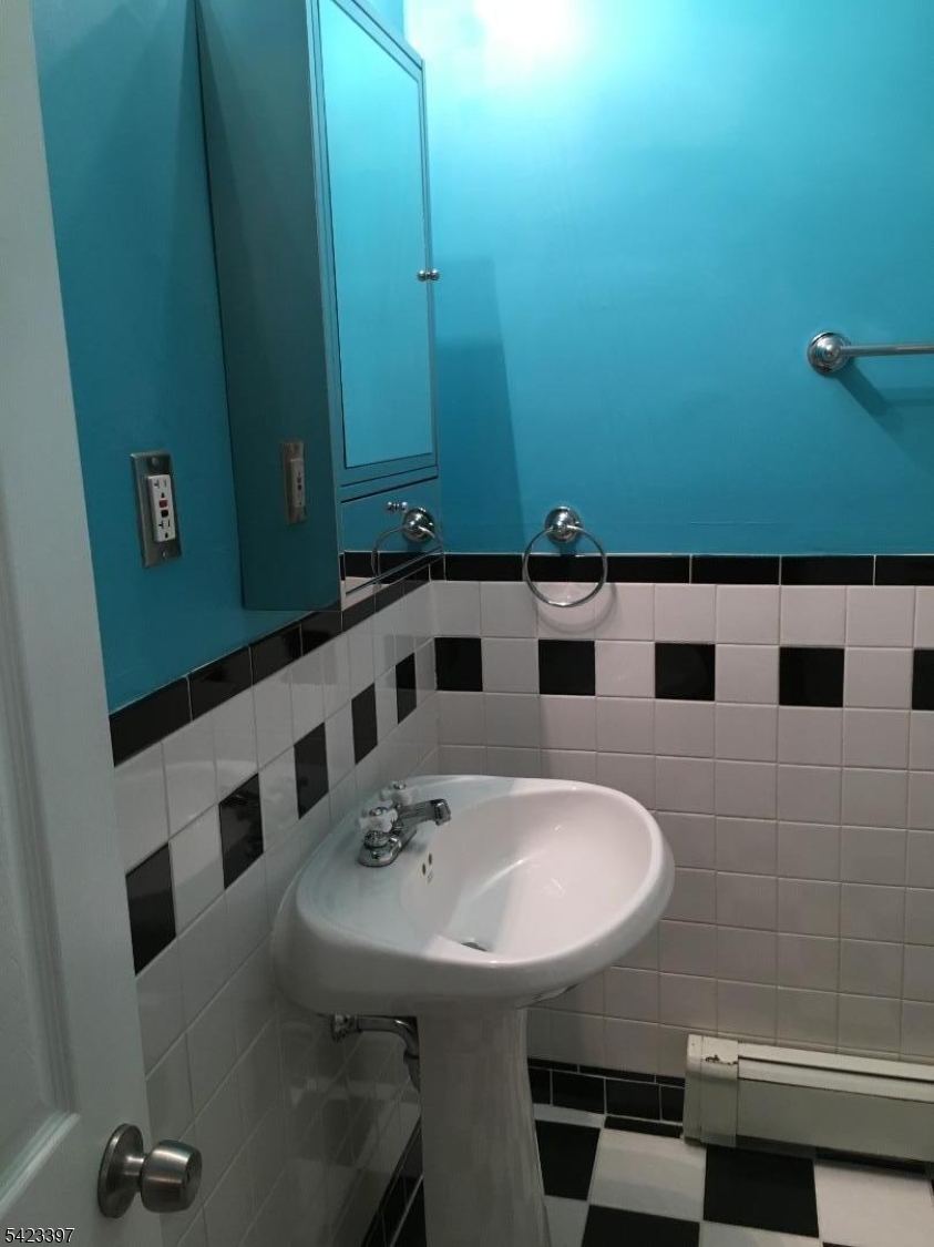 1130 Valley Road, Unit 2B Wayne, NJ 07470 - Photo 12 of 18 a bathroom with a sink and a mirror