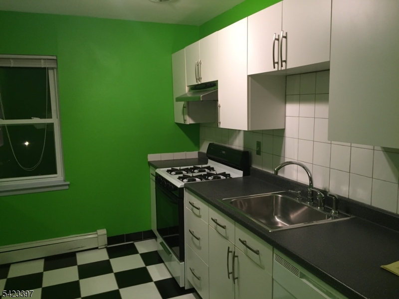 1130 Valley Road, Unit 2B Wayne, NJ 07470 - Photo 16 of 18 a kitchen with a sink cabinets and stainless steel appliances