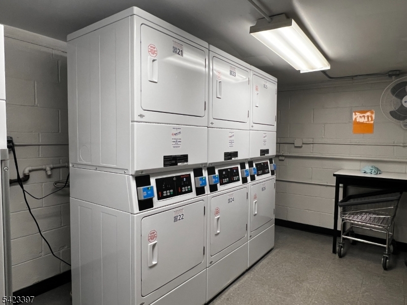 1130 Valley Road, Unit 2B Wayne, NJ 07470 - Photo 18 of 18 a kitchen with cabinets and white appliances