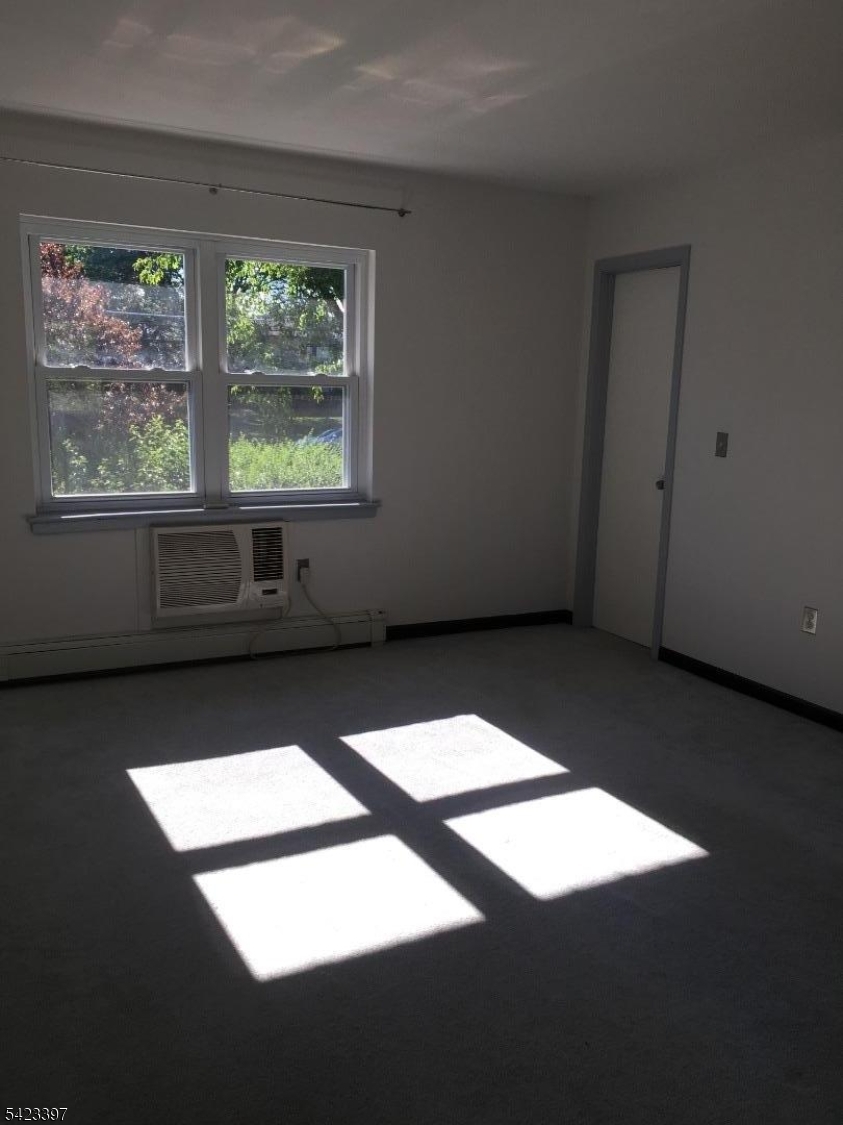 1130 Valley Road, Unit 2B Wayne, NJ 07470 - Photo 5 of 18 a view of an empty room with windows