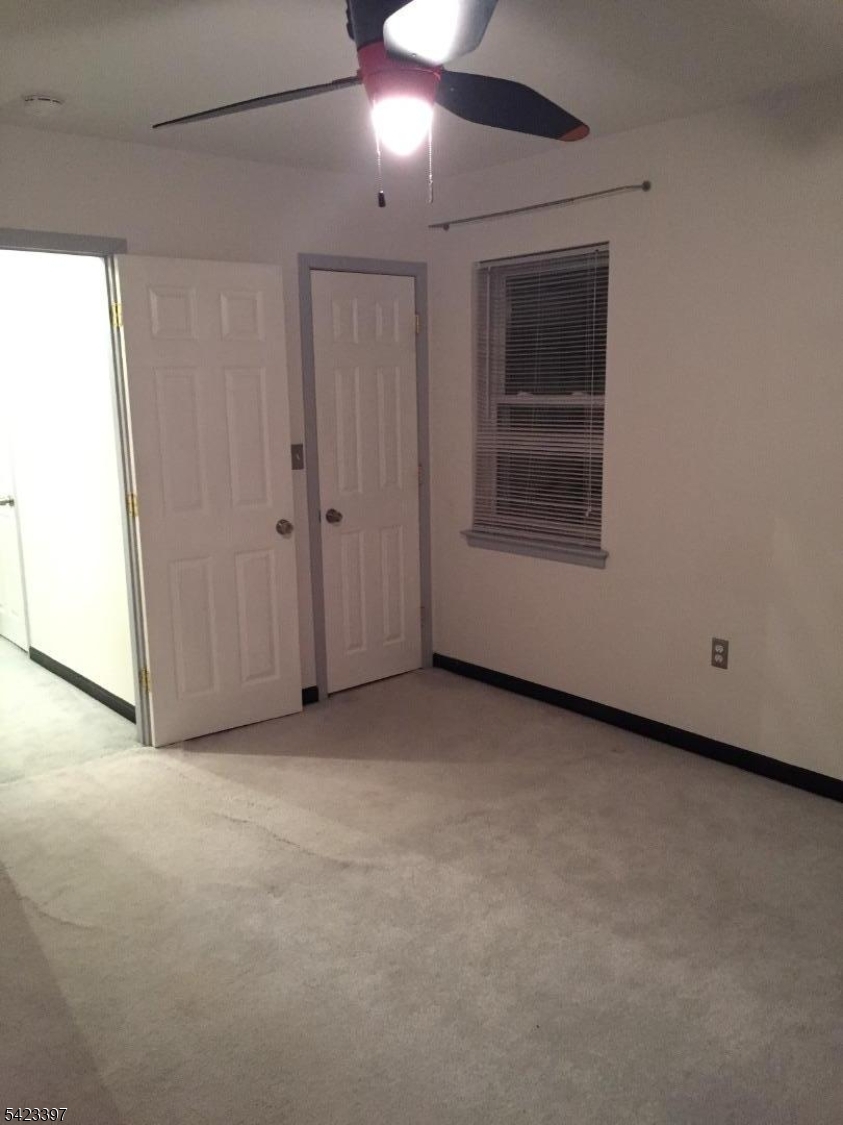 1130 Valley Road, Unit 2B Wayne, NJ 07470 - Photo 6 of 18 a view of empty room with windows