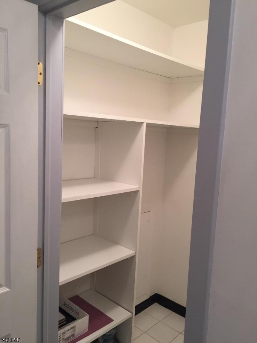 1130 Valley Road, Unit 2B Wayne, NJ 07470 - Photo 9 of 18 a view of an empty walk in closet