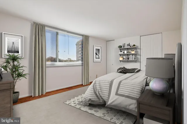 a bathroom with a sink vanity mirror and toilet