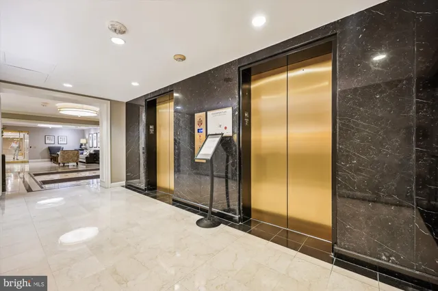 a street sign on a sidewalk next to a road