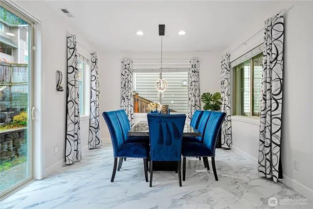 a view of a dining room with furniture window and wooden floor