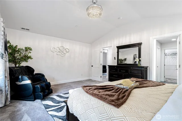 a bedroom with a bed and a dresser