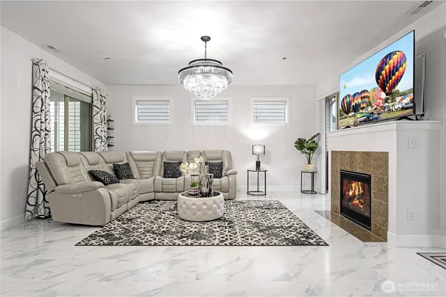 a living room with furniture or couch and a fireplace